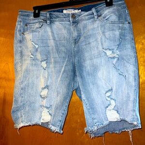 Distressed denim shorts.